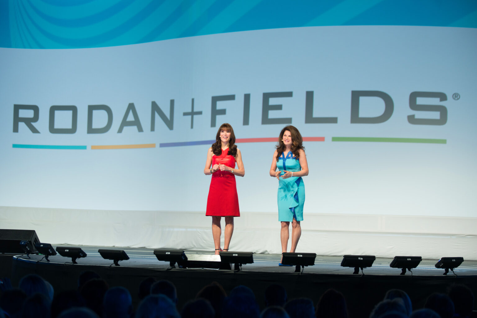 Keynote speaker presenting on high tech stage in Orlando convention center